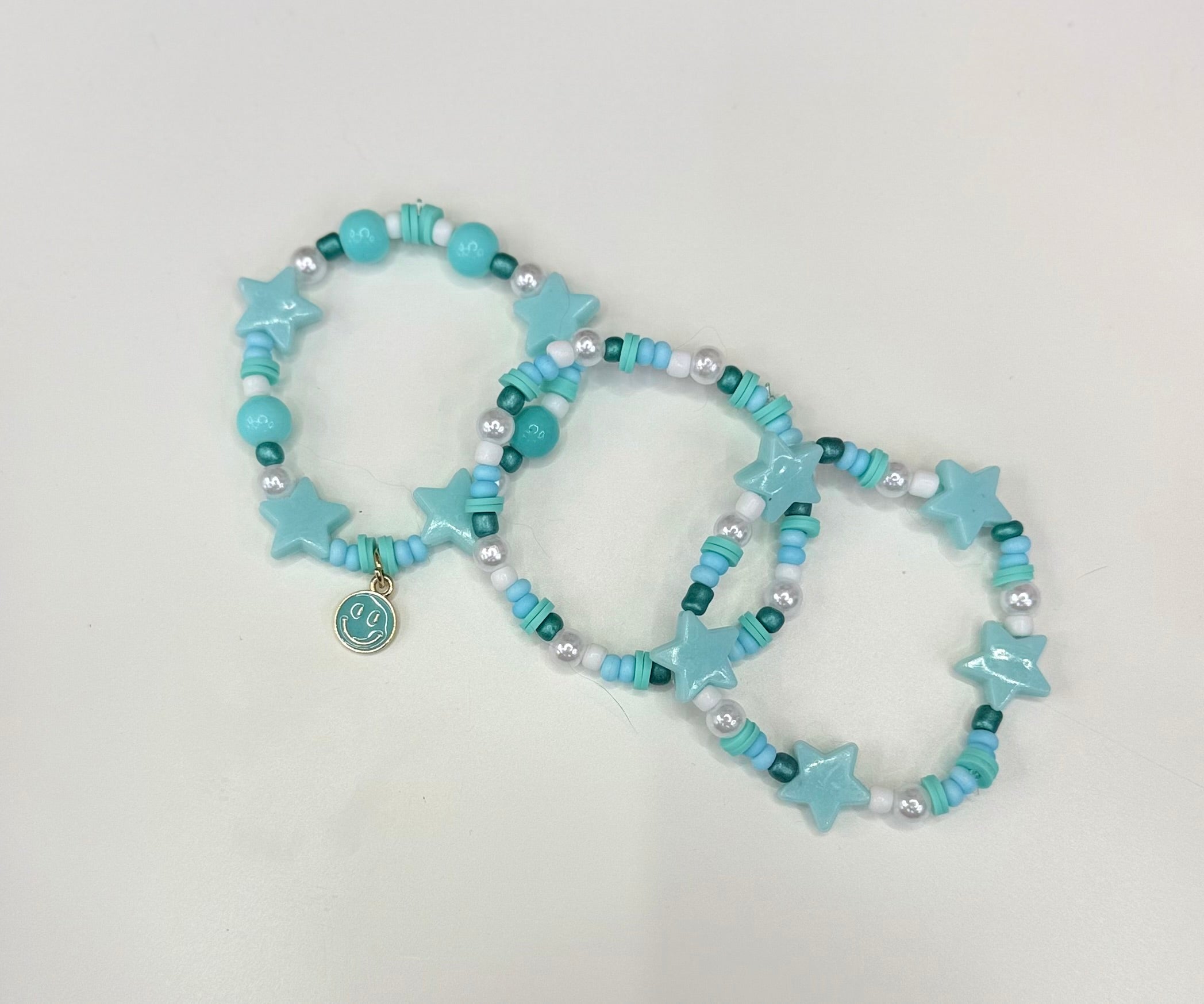 Blue star smiley bracelet stack (3)